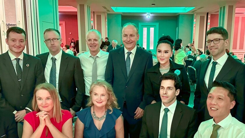 Group dinner featuring Taoiseach Micheál Martin, Senator Mary Fitzpatrick, and a member of the Irish business community, discussing collaborative opportunities for social and economic development.