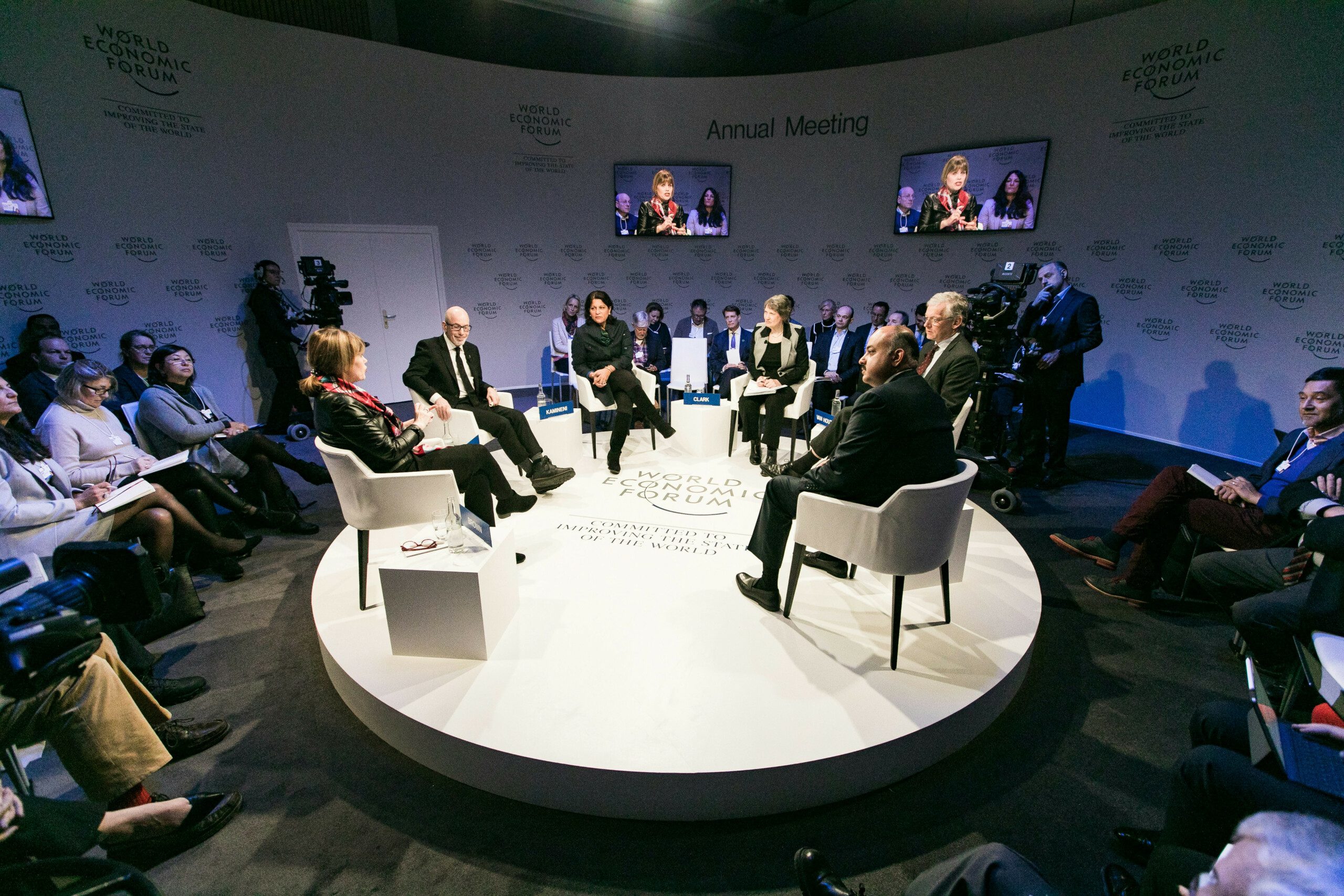 Distinguished thought leaders and policymakers engage in deep discussion at the annual Davos roundtable, focused on creating systemic solutions for global challenges.